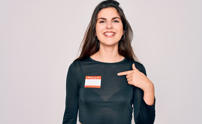 Young,Beautiful,Girl,Wearing,Hello,My,Name,Is,Sticker,Over