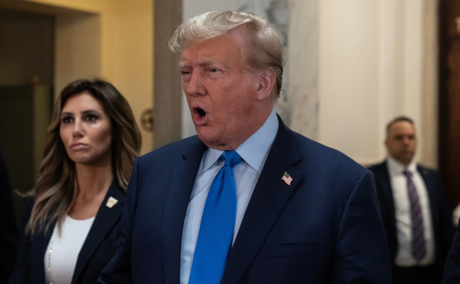 Former,President,Donald,Trump,Speaks,To,Press,Before,The,Start