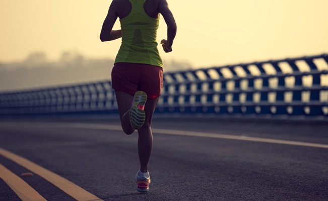 Fitness,Woman,Runner,Running,On,Seaside,Bridge