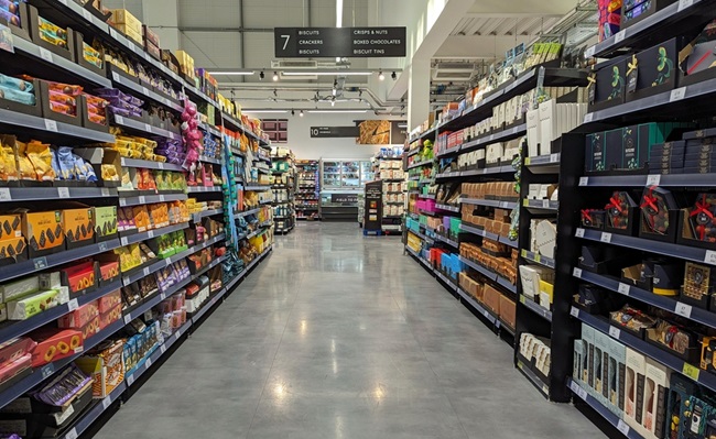An,Aisle,With,Shelves,Full,Of,Food,Products,Is,Seen