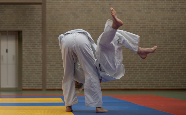 Two,Children,Practising,Judo,Martial,Arts.,Indoors.,Boy,Throws,Another
