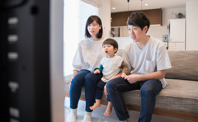 Family,Watching,Tv,In,The,Living,Room