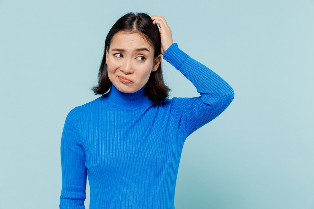 Confused,Puzzled,Preoccupied,Young,Woman,Of,Asian,Ethnicity,20s,Years