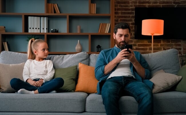 Bored,Child,Girl,Resting,At,Home,With,Father,Young,Dad
