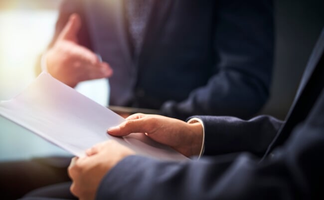 Close-up,Shot,Of,Two,Asian,Business,Men,Having,A,Discussion