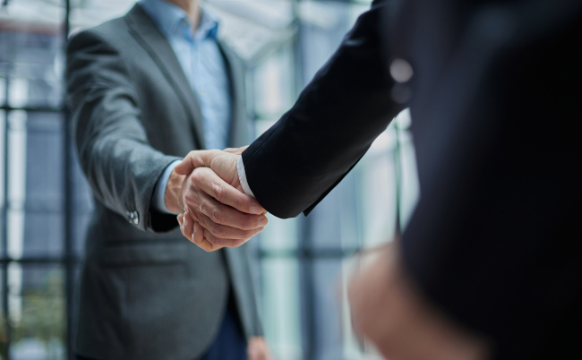 Two,Diverse,Professional,Business,Men,Executive,Leaders,Shaking,Hands,At