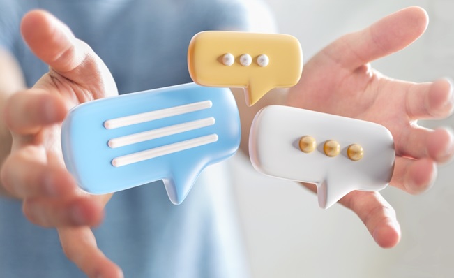 Businessman,Holding,Digital,Colorful,Speech,Bubbles,Talk,Icons.,Minimal,Conversation