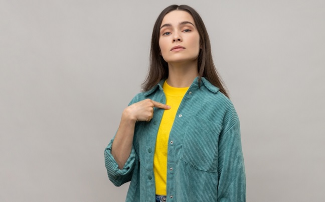 Confident,Egoistic,Woman,Pointing,On,Herself,With,Arrogance,And,Satisfaction,