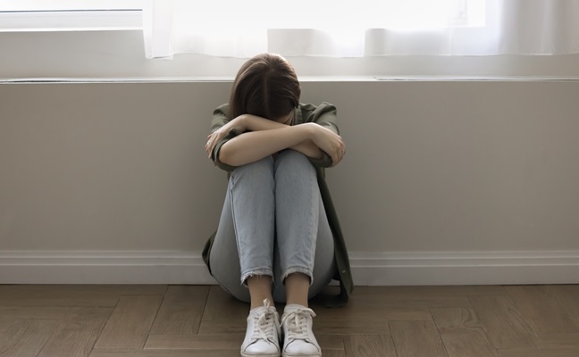 Unhappy,Lonely,Stressed,Young,Teen,Girl,Sitting,On,Floor,At
