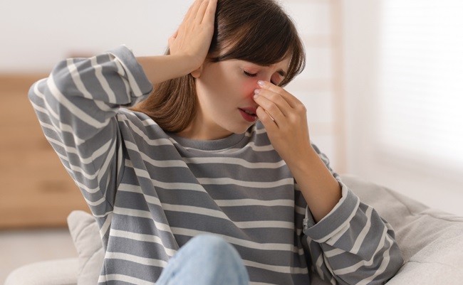 Tired,Woman,Suffering,From,Sinusitis,At,Home