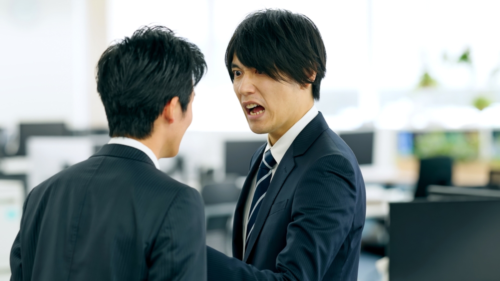 Asian,Businessman,Boss,Yelling,At,Subordinate,In,Modern,Office.