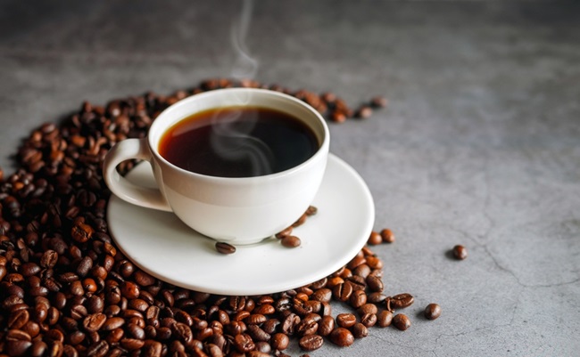 Coffee,Cup,And,Coffee,Beans,On,Gray,Background,,Black,Coffee