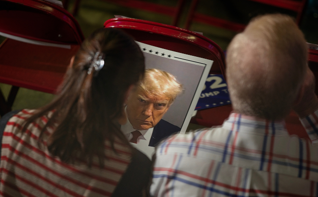 Donald,Trump,Supporters,Hold,A,Poster,With,A,Photo,Of