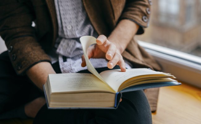 Young,Man,Reading,A,Book
