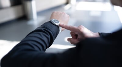 A,Person,In,Black,Sleeve,Looking,And,Pointing,At,His