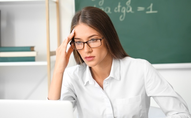 Stressed,Young,Female,Teacher,In,Classroom