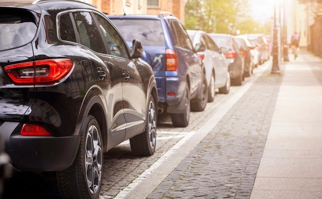 Car,Parking,Problem,In,City,Street.,Many,Cars,Parked,Along