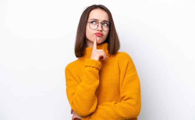 Young,Ukrainian,Woman,Isolated,On,White,Background,Having,Doubts,While