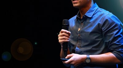 The,Male,Speaker,Is,Doing,The,Public,Speaking,With,The