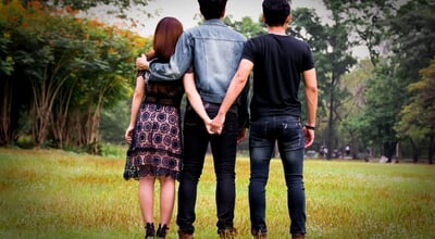 Love,Triangle.,Young,Woman,In,Relationship,With,Two,Men.back,View