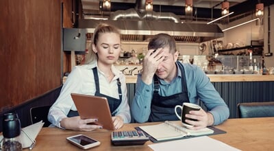 Young,Entrepreneurs,Overwhelmed,By,Finance,Problems,-,Nervous,Manager,Checking