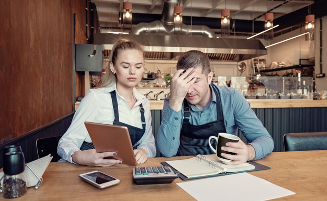 Young,Entrepreneurs,Overwhelmed,By,Finance,Problems,-,Nervous,Manager,Checking