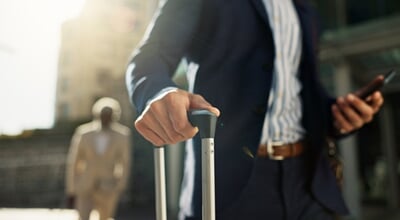 Business,Man,,Phone,And,Suitcase,In,Street,,Hands,And,Search