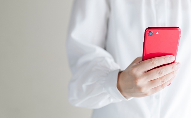 Woman's,Hand,Holding,A,Smartphone