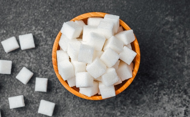 A,Bowl,Filled,With,Square,White,Sugar,Cubes,Sits,On