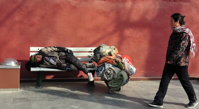 Beijing,-,Mar,112009:adult,Chinese,Woman,Looks,At,Homeless,Sleeping