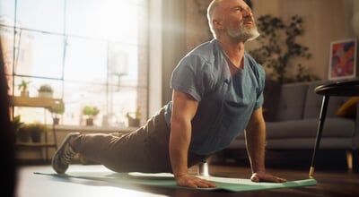 Strong,Athletic,Fit,Senior,Man,Training,On,A,Yoga,Mat,