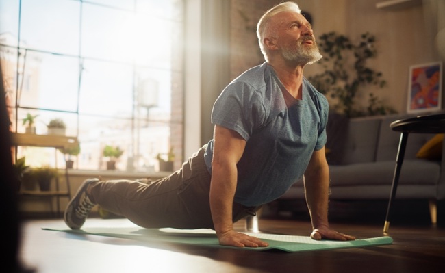 Strong,Athletic,Fit,Senior,Man,Training,On,A,Yoga,Mat,