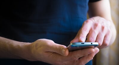 Close,Up,Of,A,Man,Using,Mobile,Smart,Phone