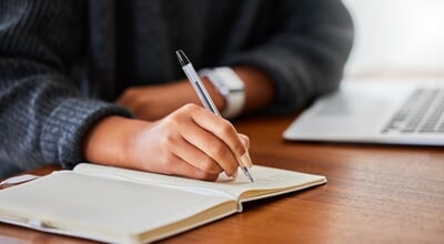 Notebook,,Writing,And,Hand,In,Home,For,Entrepreneurship,,Small,Business