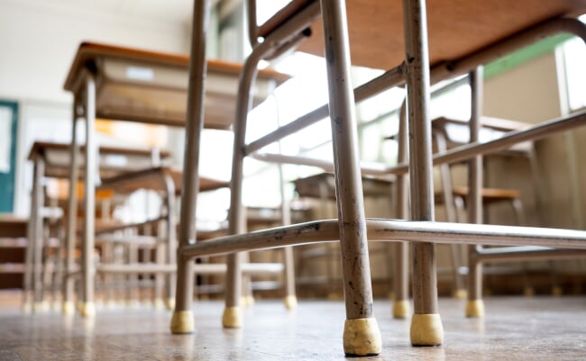 Desks,And,Chairs,In,A,Japanese,School,Classroom.,Low,Angle