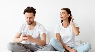 Woman,Reading,Husband's,Phone,Messages,While,He,Texting,In,Social