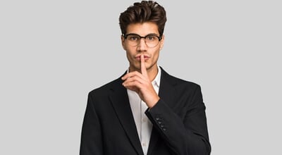 Young,Caucasian,Business,Man,Isolated,Keeping,A,Secret,Or,Asking
