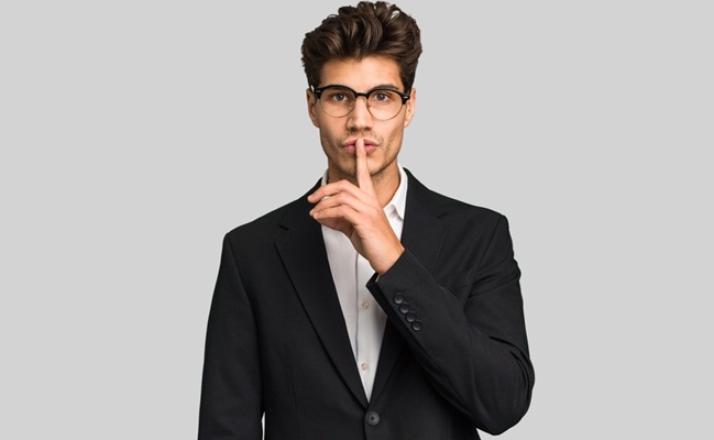 Young,Caucasian,Business,Man,Isolated,Keeping,A,Secret,Or,Asking
