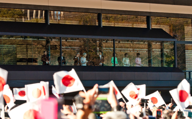 Tokyo,/,Japan,-,01.02.2019:,Crowds,Waiving,Paper,Flags,As