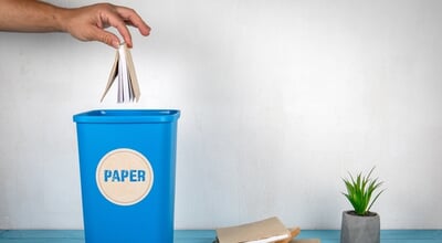 Paper,Sorting,And,Recycling.,Man's,Hand,Throws,A,Book,In