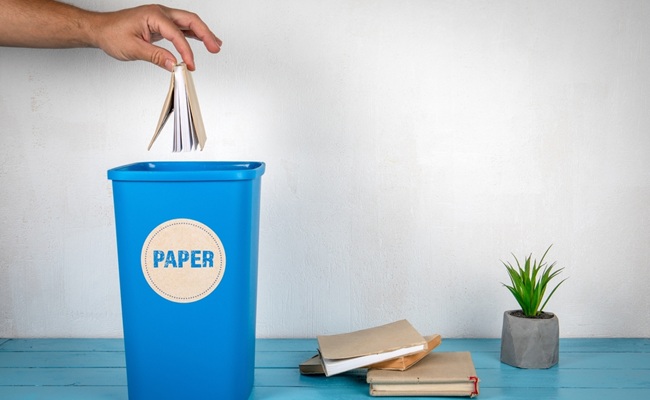 Paper,Sorting,And,Recycling.,Man's,Hand,Throws,A,Book,In