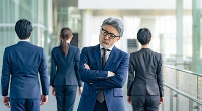 Senior,Male,Business,Person,Facing,Away,From,Subordinates,And,Worried