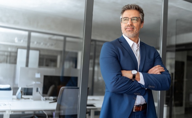 Portrait,Of,Indian,Or,Latin,Hispanic,Mature,Middle,Age,Boss,