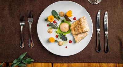 Portion,Of,Gourmet,White,Fish,Dish,With,Fruit,Slices,And