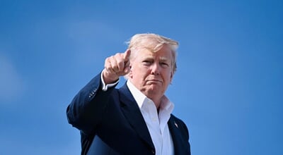 President,Donald,Trump,Points,As,He,Boards,Air,Force,One