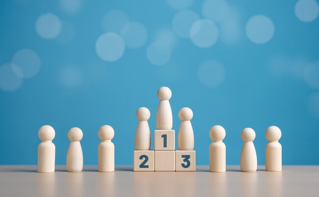 Wooden,Human,Figures,Standing,On,The,Podium,With,Ranking,For