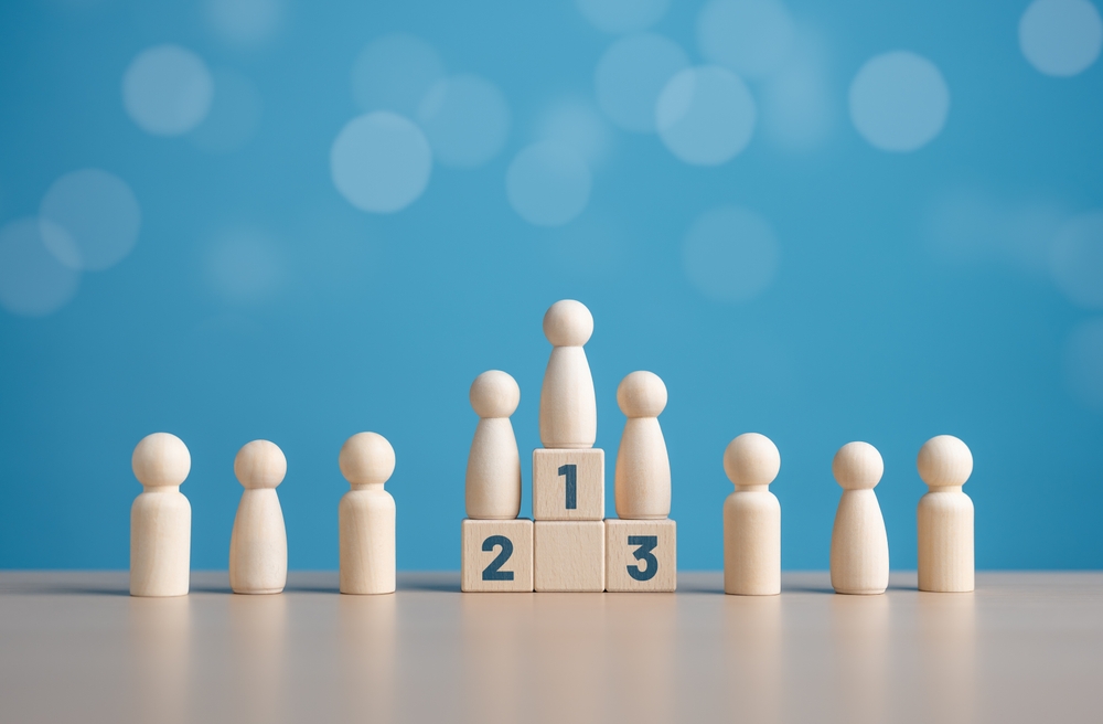 Wooden,Human,Figures,Standing,On,The,Podium,With,Ranking,For