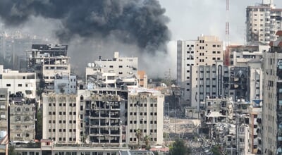 Smoke,Rising,Behind,Destroyed,Buildings,In,Gaza,,Aerial,View,Drone