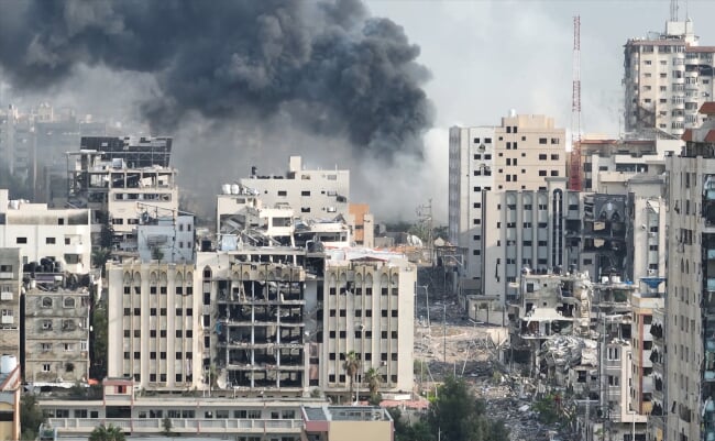 Smoke,Rising,Behind,Destroyed,Buildings,In,Gaza,,Aerial,View,Drone