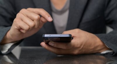 A,Close-up,Image,Of,A,Person's,Hands,Using,A,Smartphone